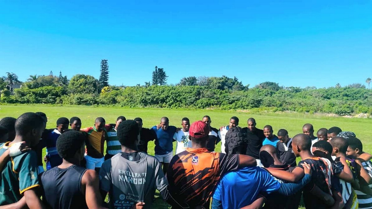 Players standing in a circle during a training session