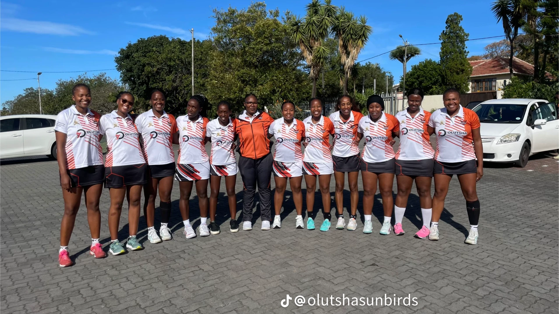 Olutsha Sunbirds netball squad lined up in club kit before a match in East London